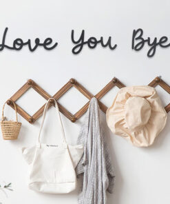 Crafted from wood, the Love You Bye Boho Wooden Sign brings a natural, warm vibe to your decor.